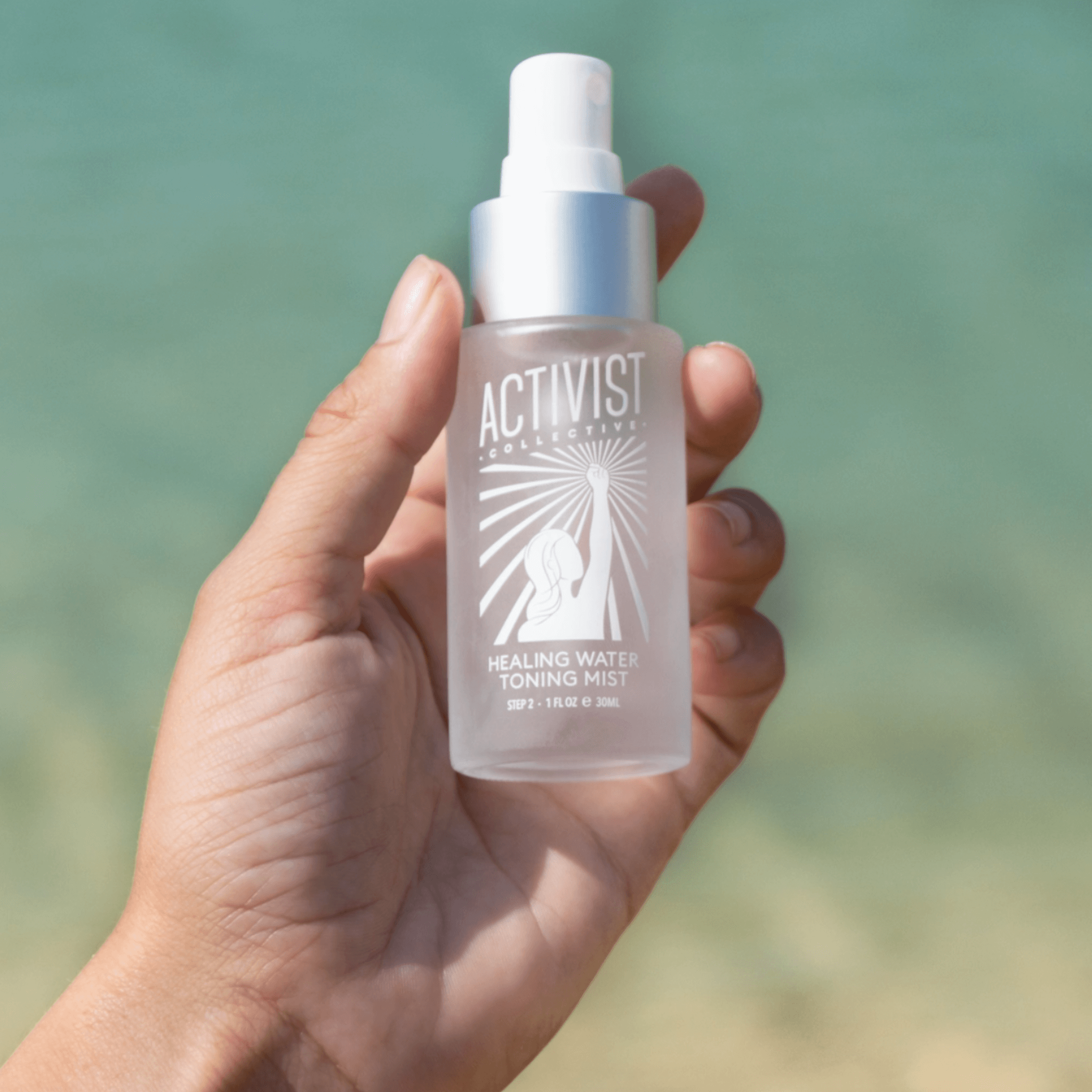 Healing Water Toning Mist in hand, providing hydration and skin nourishment with botanicals and a refreshing scent.