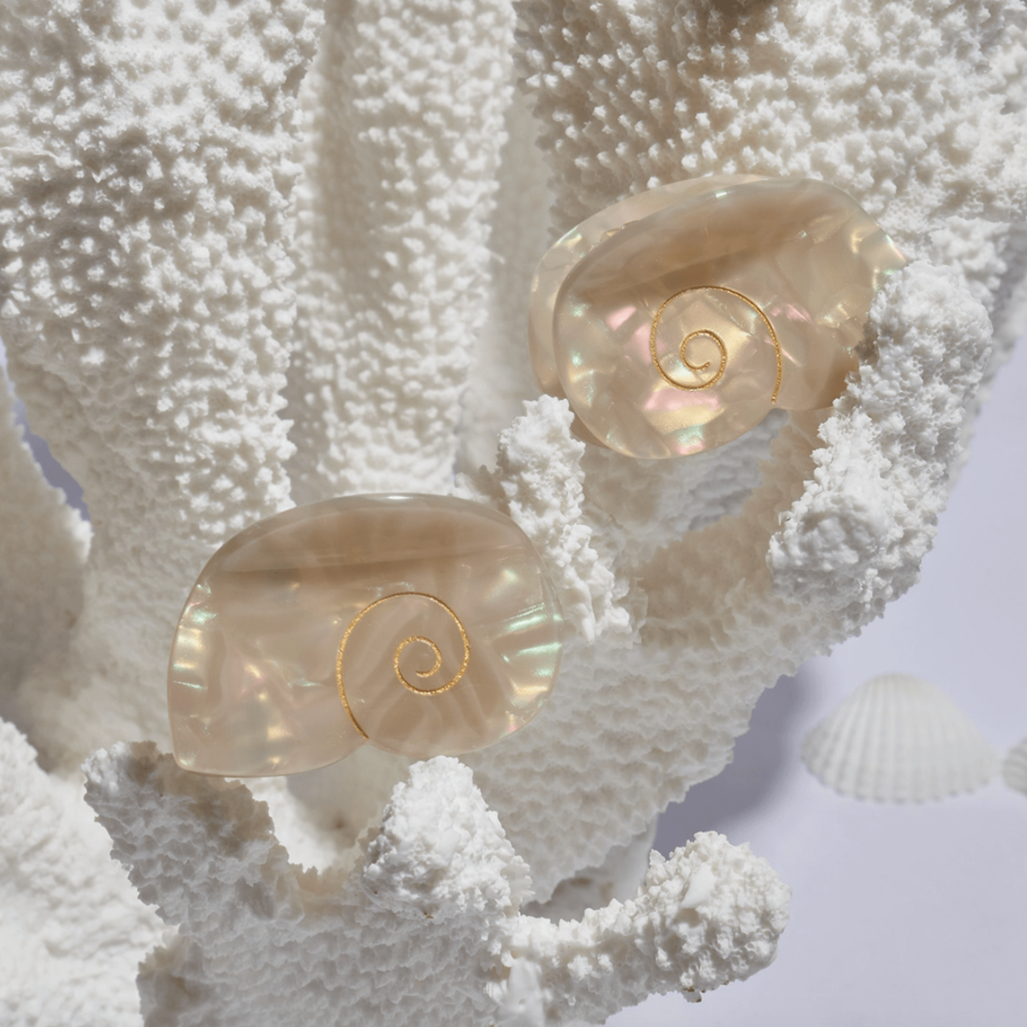 Siren Mini Hair Claw in iridescent seashell design, perfect for adding mermaid energy to any hairstyle.