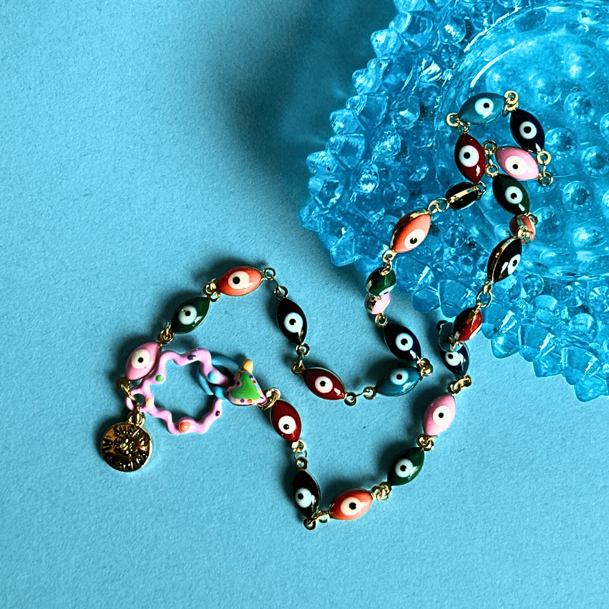 Colorful Malak Necklace with enamel evil eye charms and gold-plated accents, symbolizing protection and good vibes.