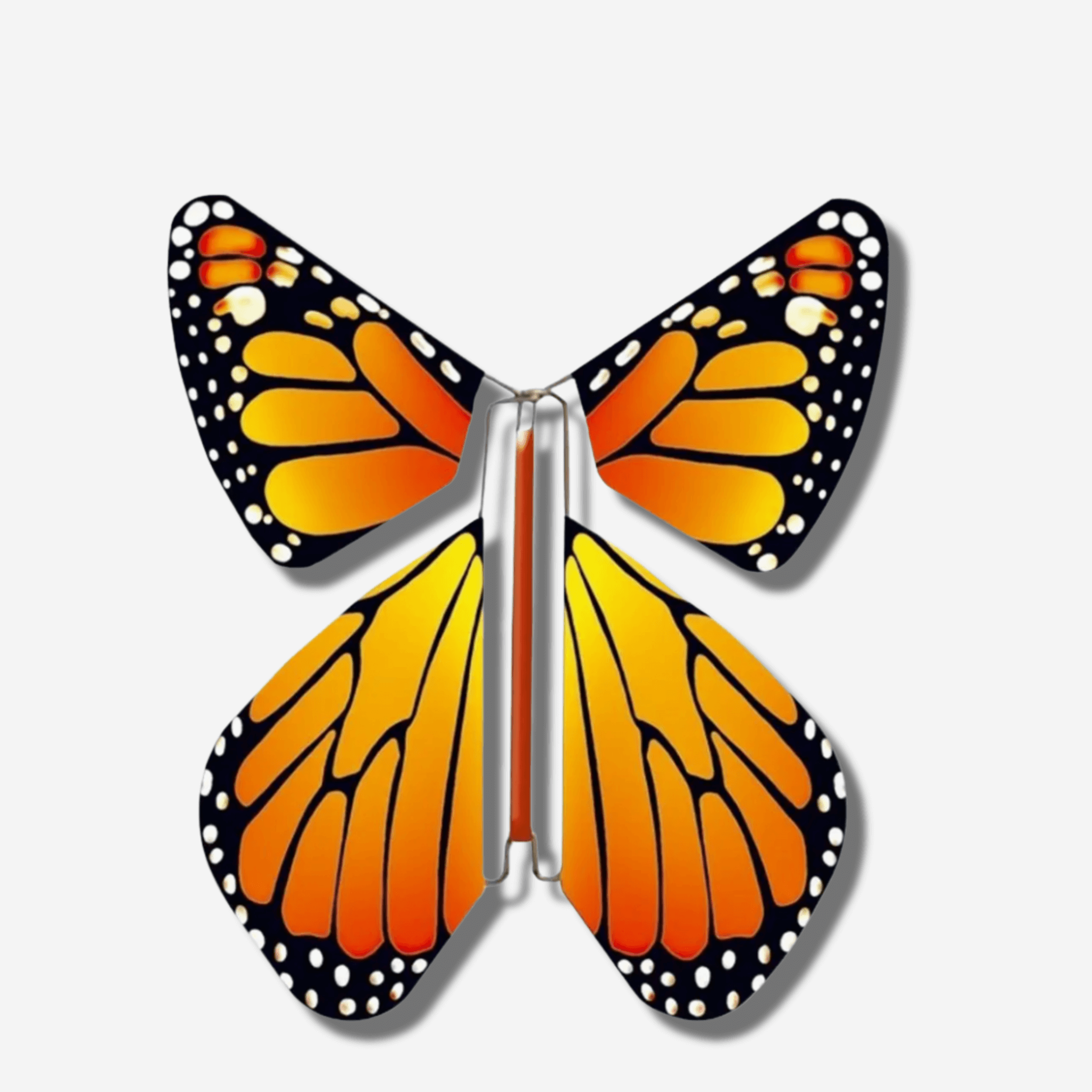 Whimsical FLYING MAGIC BUTTERFLY® in vibrant orange and black ready to delight and surprise with its enchanting flight.