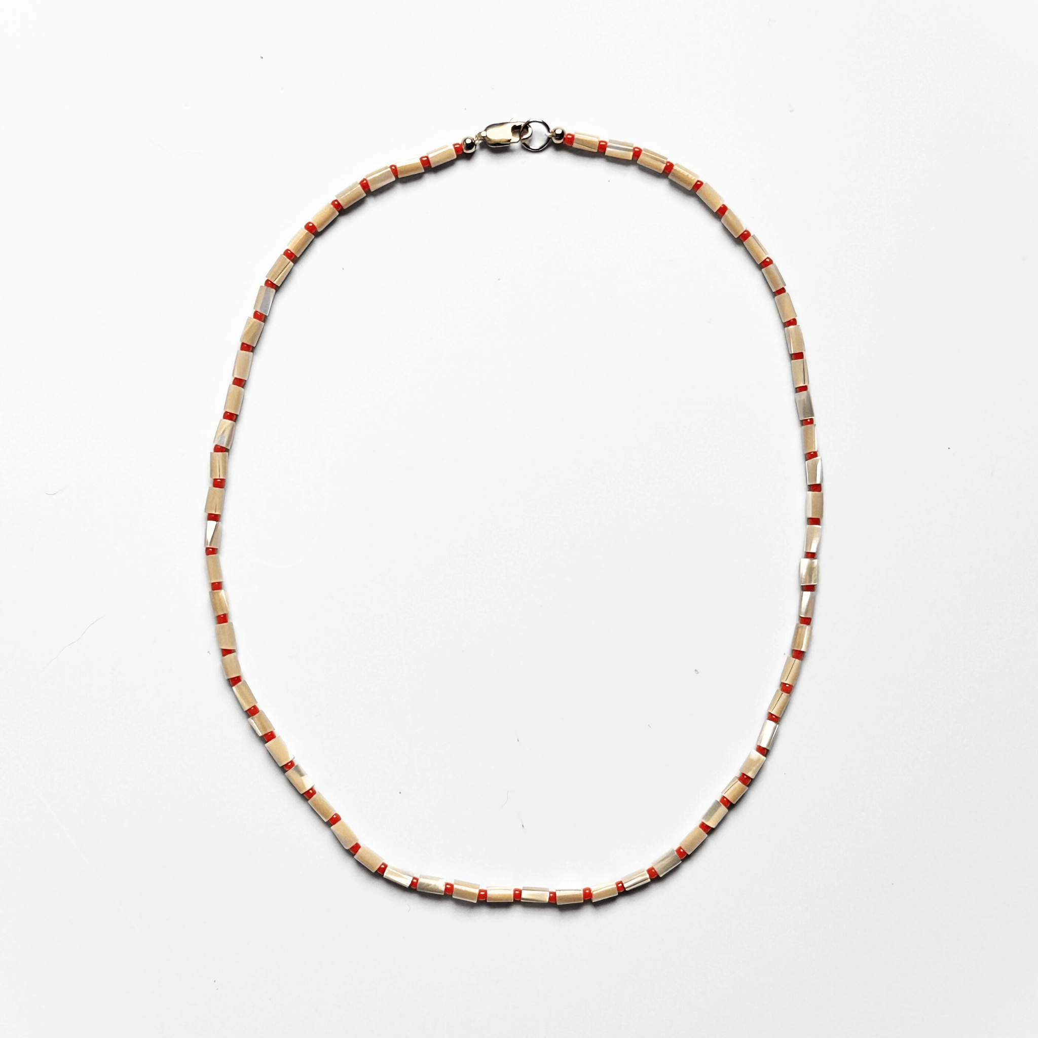 KARO NECKLACE featuring mother of pearl and Japanese glass beads in warm sunset tones on silk with gold-filled accents.
