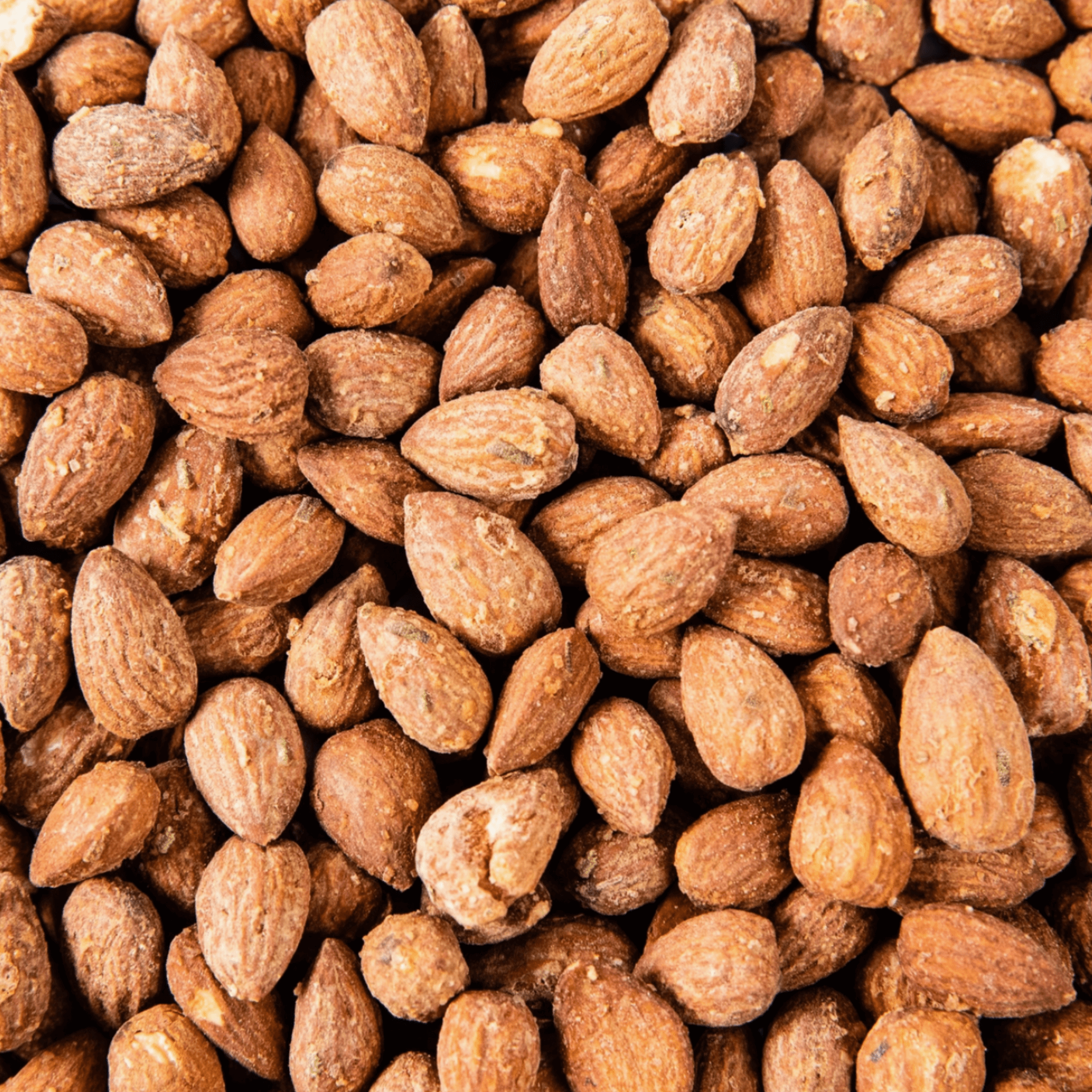 Close-up of rosemary garlic spiced almonds, showcasing their crunchy, herbaceous texture and natural appeal.