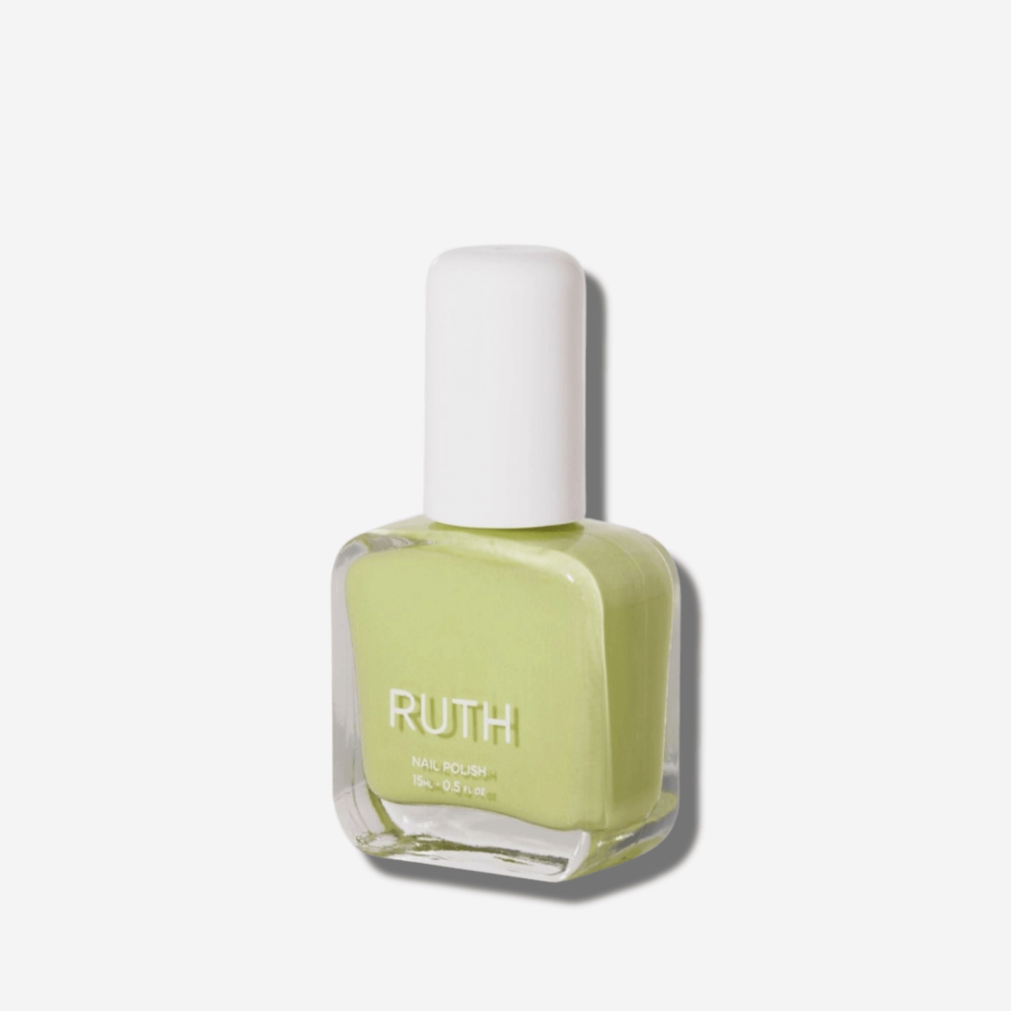 Ruth Veggie Nail Polish in a crisp light green shade, 10-free, vegan, and cruelty-free for a playful look.