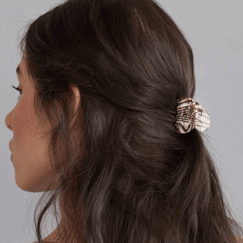 Model showcasing a stylish mini hair claw clip in rich agate pattern, perfect for elegant updos and everyday hair styles.