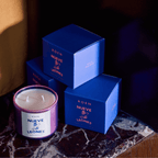 Nueve Leones candle in stylish packaging showcasing bold design and cozy ambiance.