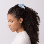 Model wearing the dreamy Lucy Hair Claw, featuring soft clouds on a blue background, capturing a serene sky vibe.