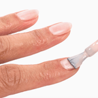 Applying Forever Wear Chill Paint - Rose Milk polish for a chic, natural look on nails.