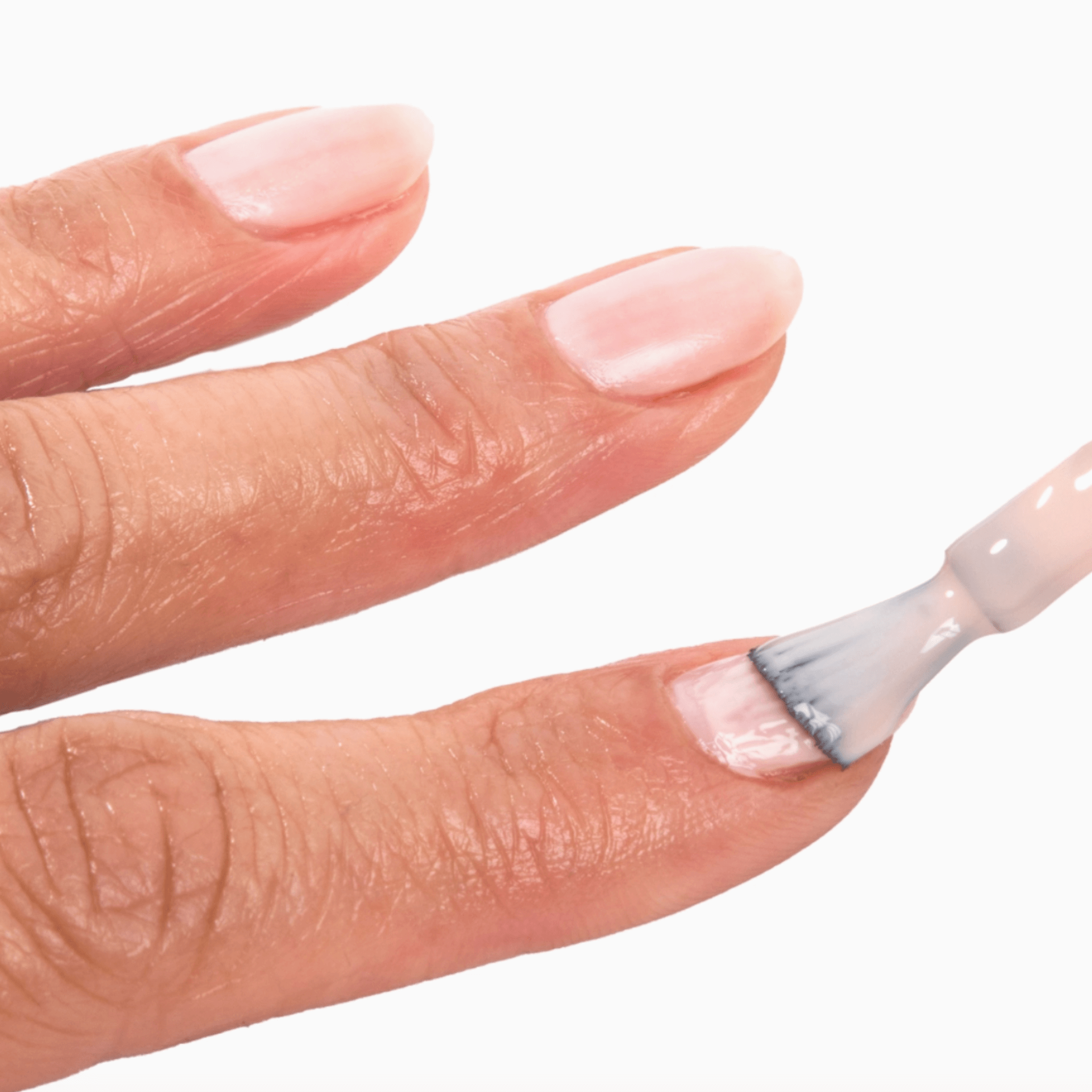 Applying Forever Wear Chill Paint - Rose Milk polish for a chic, natural look on nails.
