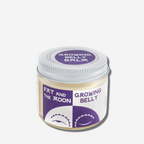 Fat and the Moon Growing Belly Balm in a stylish jar, perfect for hydrating stretching skin and keeping it supple.