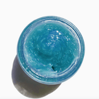 Vivid blue gel-to-milk cleansing gel in a jar, perfect for removing makeup and hydrating skin.
