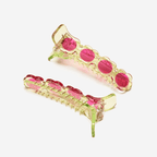 Vibrant watermelon radish alligator hair clips in pink and green, perfect for playful and chic hairstyles.