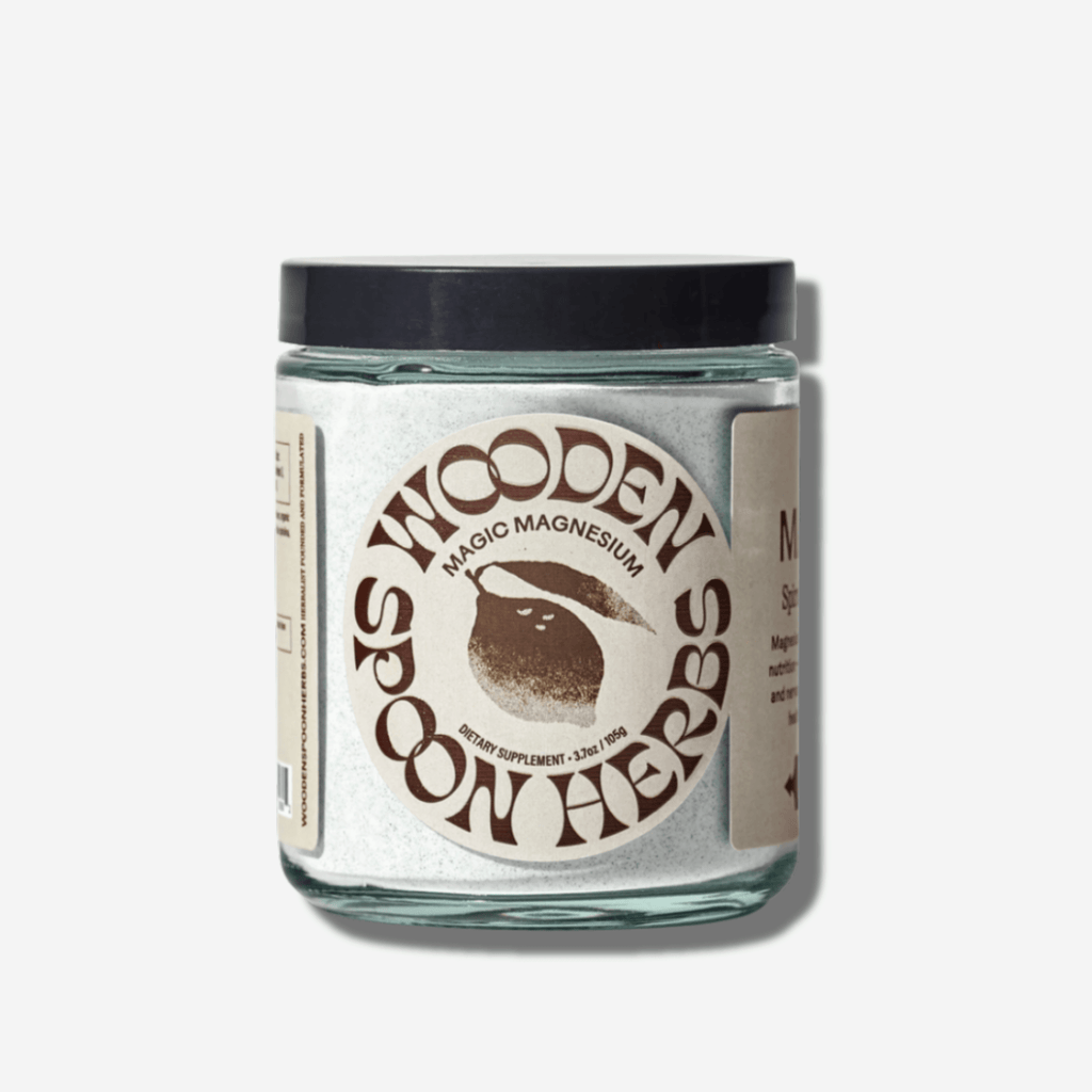 Wooden Spoon Herbs Magic Magnesium jar, a spirulina blue lemonade blend for energy and hydration in every scoop.