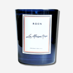 Elegant La Maison Rose candle in a blue glass container with coconut wax, inspired by the scents of Provence.