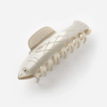 HERRING HAIR CLAW in a fish shape, crafted from glossy cellulose acetate, perfect for securing hair while adding a whimsical touch.