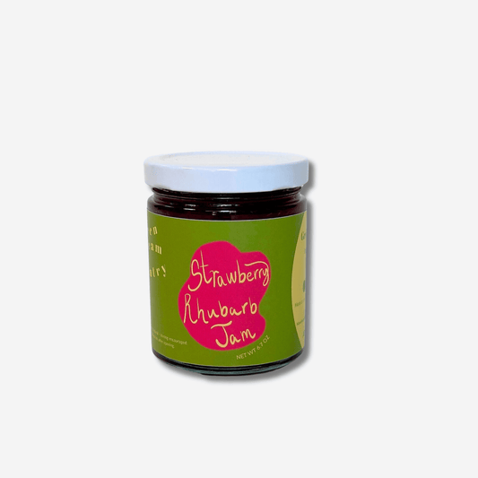 Jar of Green Dream Pantry Strawberry Rhubarb Jam, a sweet-tart blend made with Oregon strawberries and rhubarb.