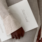 Person holding The Reset Guide workbook, a tool for self-discovery and authentic living.