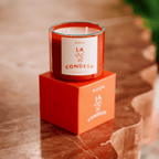 LA CONDESA candle on a marble table, featuring vibrant packaging and a tropical, chic design.