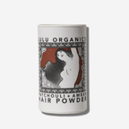 Lulu Organics Patchouli and Amber Hair Powder in chic recyclable tube, perfect for oil absorption and volume on-the-go.