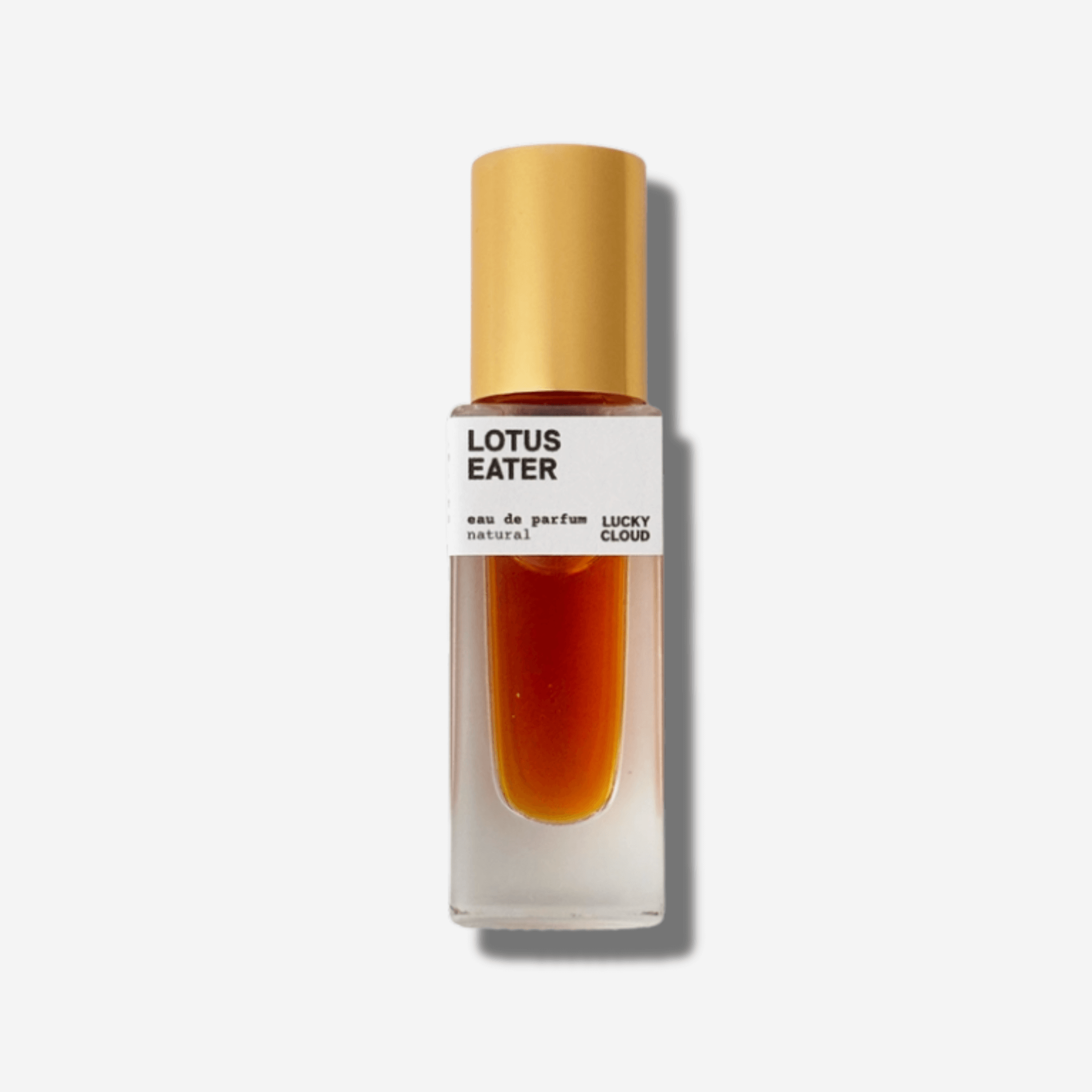 Lotus Eater natural perfume bottle showcasing a blend of pink lotus, orange blossom, and vanilla orchid.