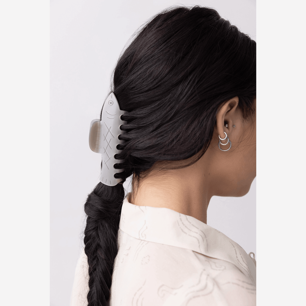 HERRING HAIR CLAW secured in a woman's hair, showcasing playful design and coastal-inspired style.