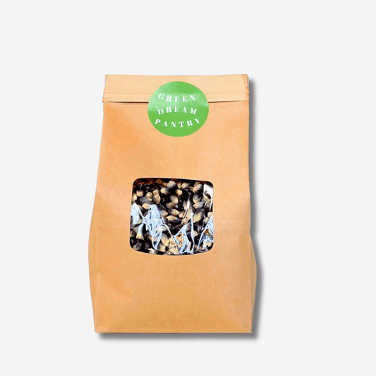 Eco-friendly packaging of Green Dream Pantry's SHAMAN'S BLUE POPCORN, showcasing organic kernels inside.