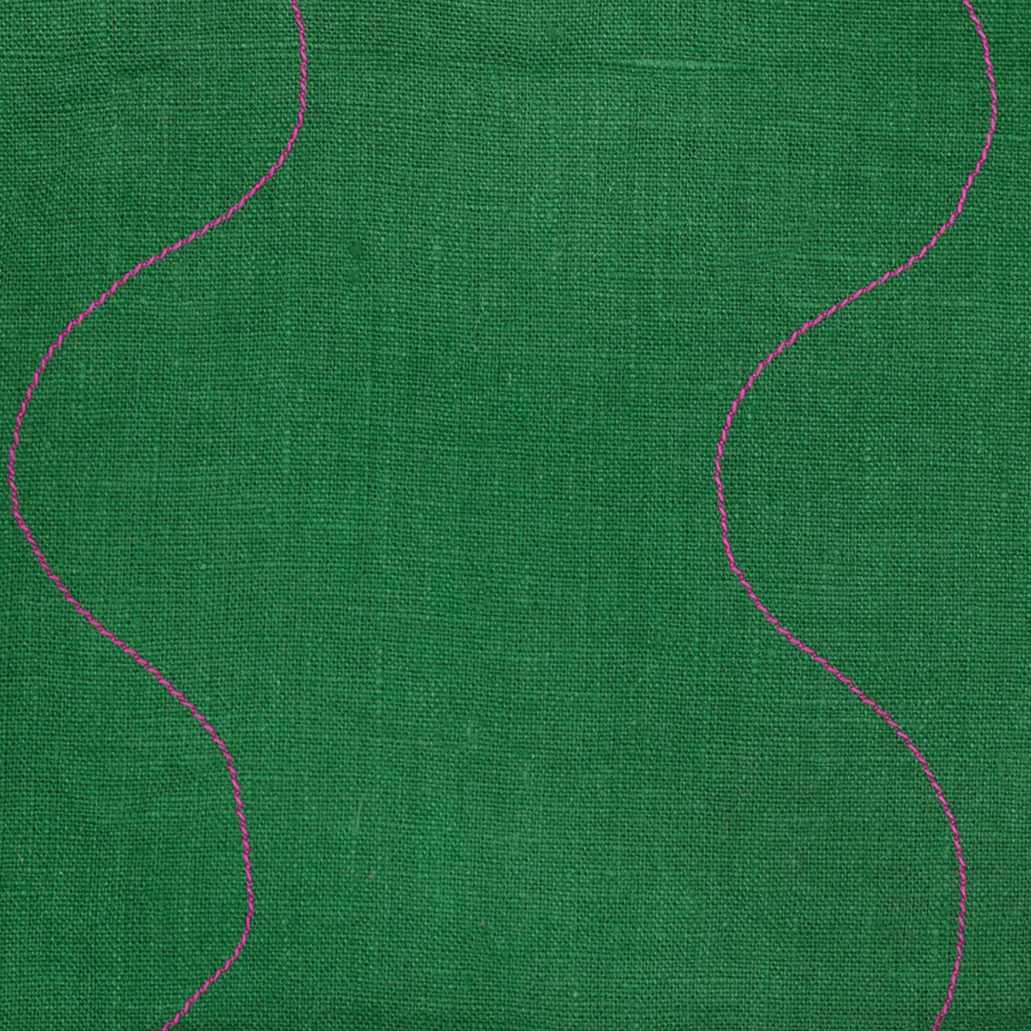 Close-up of a vibrant green linen fabric with pink wavy stitched details, perfect for kitchen or bath use.