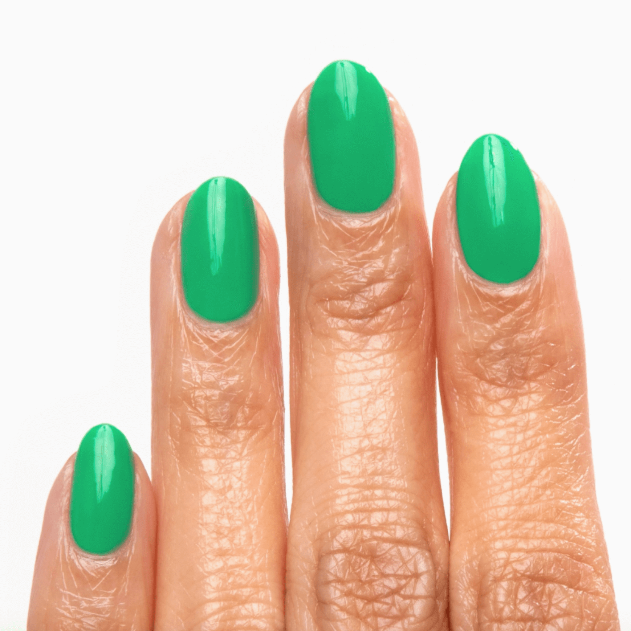 Close-up of manicured nails painted with Forever Wear Chill Paint in dreamy jade green.