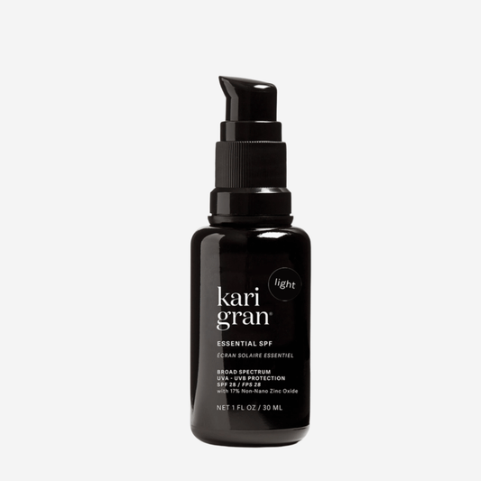 Kari Gran Essential Tinted SPF 30 oil-based mineral sunscreen in 1 fl oz bottle with pump dispenser.