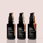 Kari Gran Essential Tinted SPF 30 bottles in Light, Medium, and Dark shades with oil dripping from tops.