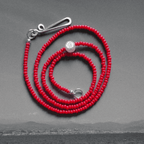 Red bead necklace with a freshwater pearl, inspired by simplicity and crafted with elegance.