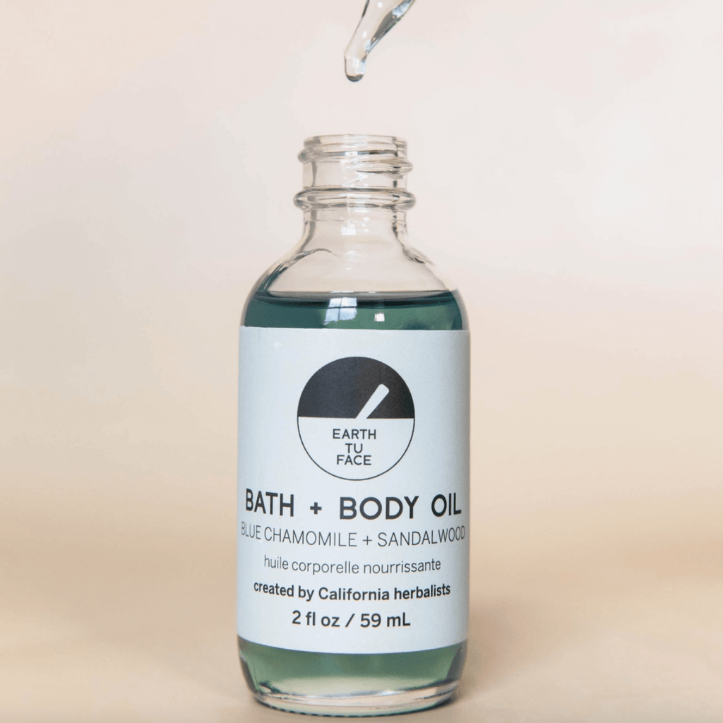 Bath and Body Oil bottle with blue chamomile and sandalwood, crafted by California herbalists, 2 oz for deep hydration.