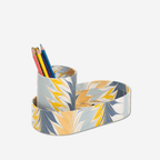 Hand-marbled tray and cup set in golden blue, crafted from recycled cotton, holding colorful pencils.