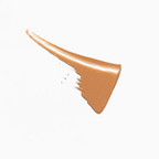 Swatch of Kari Gran's Essential Tinted SPF 30 in a warm, natural shade, showcasing its creamy texture.