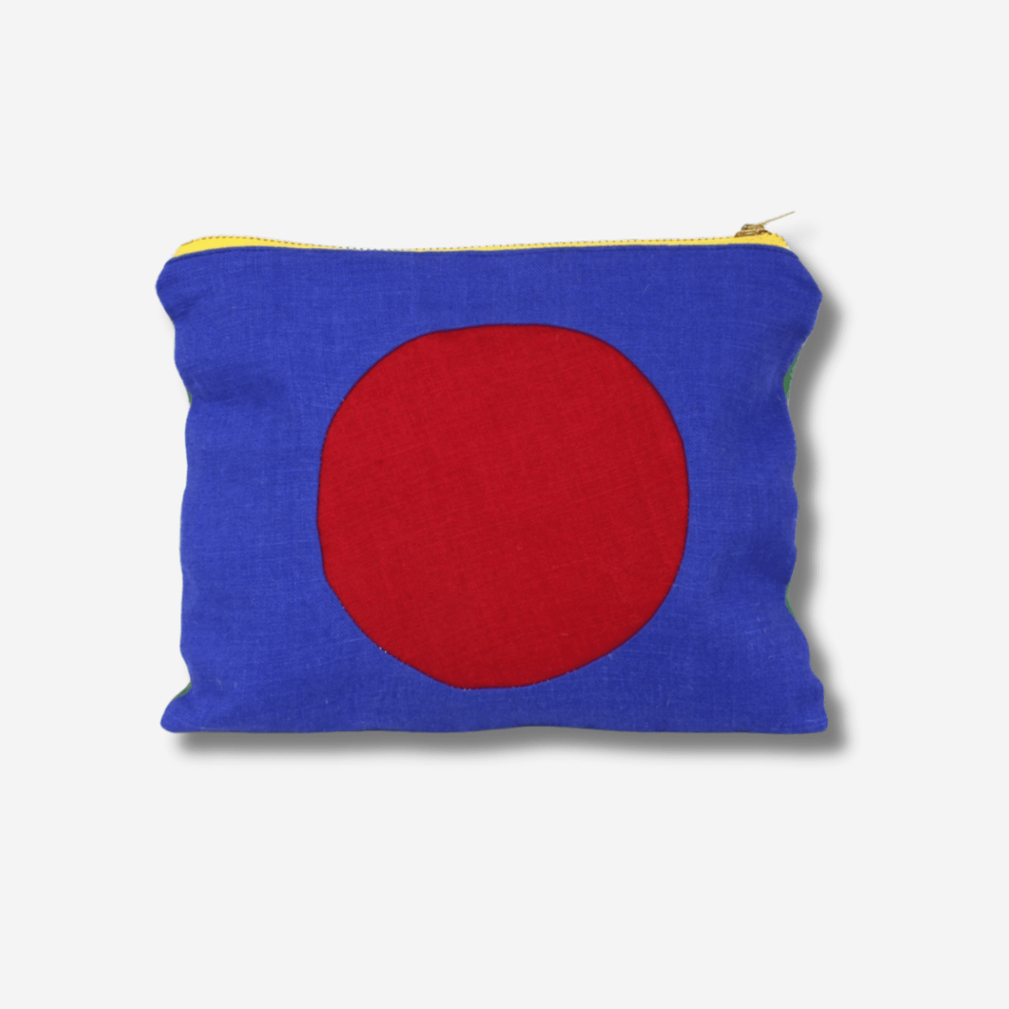 CIRCLE LINEN ZIPPER POUCH in blue and red featuring a bold brass zipper, perfect for makeup or travel essentials.