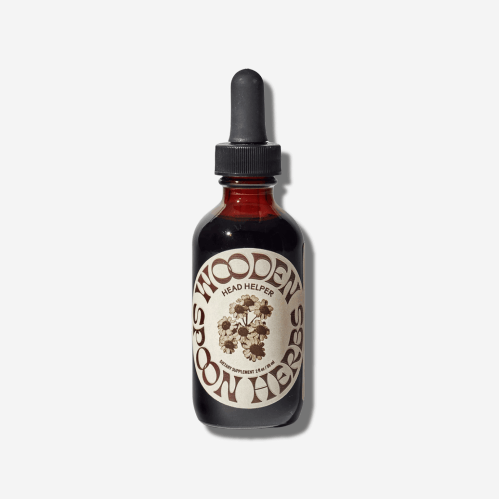 Amber glass bottle of Wooden Spoon Herbs Head Helper herbal tincture for relaxation and stress relief.