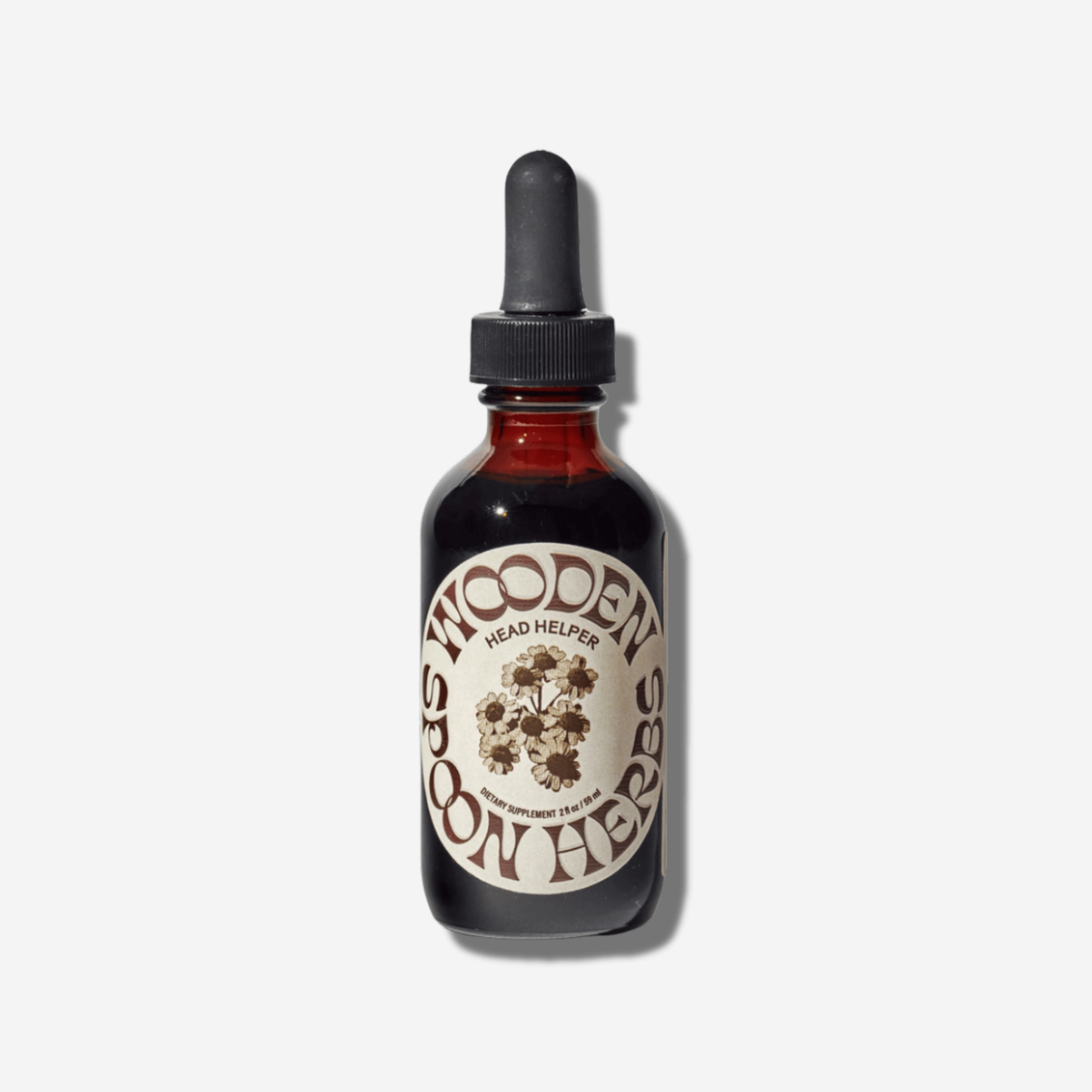 Amber glass bottle of Wooden Spoon Herbs Head Helper herbal tincture for relaxation and stress relief.