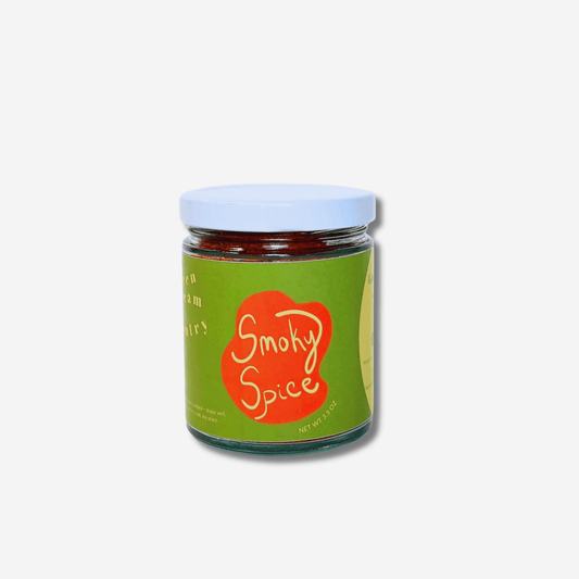 Jar of Green Dream Pantry's Smoky Spice blend featuring bold flavors for grilling and roasting.