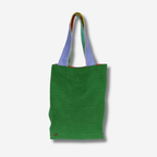 Small linen tote bag in green with colorful straps, perfect for errands and minimalist style.