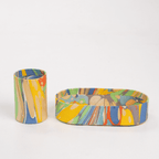 Vibrant hand-marbled tray and cup set in rainbow colors, perfect for organizing desk essentials and adding style.