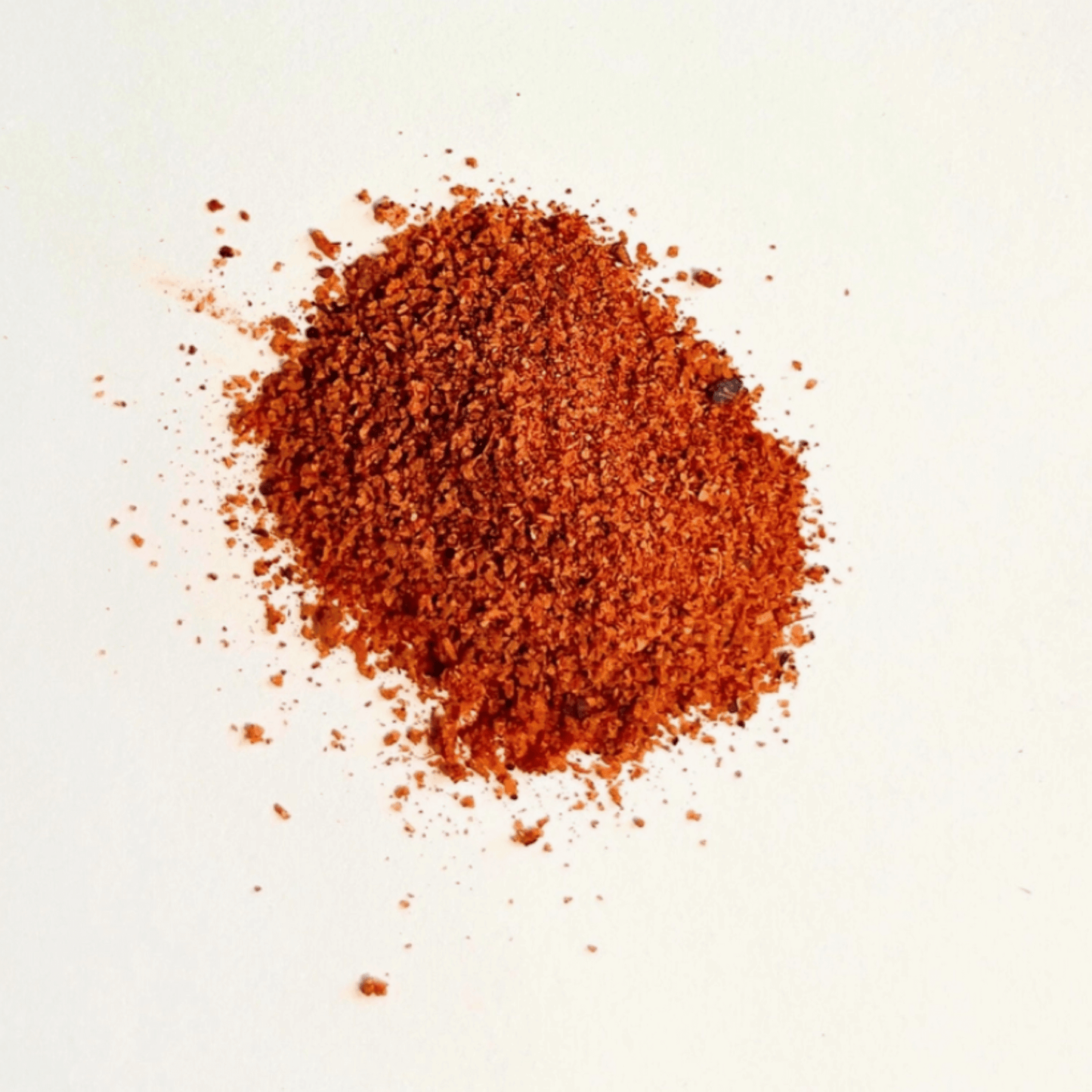 A pile of smoky spice blend featuring Spanish pimentón, mesquite, and Turkish silk chili for deep flavor.