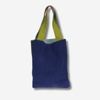 Small linen tote bag in navy blue with multicolored straps, perfect for everyday essentials and on-the-go use.