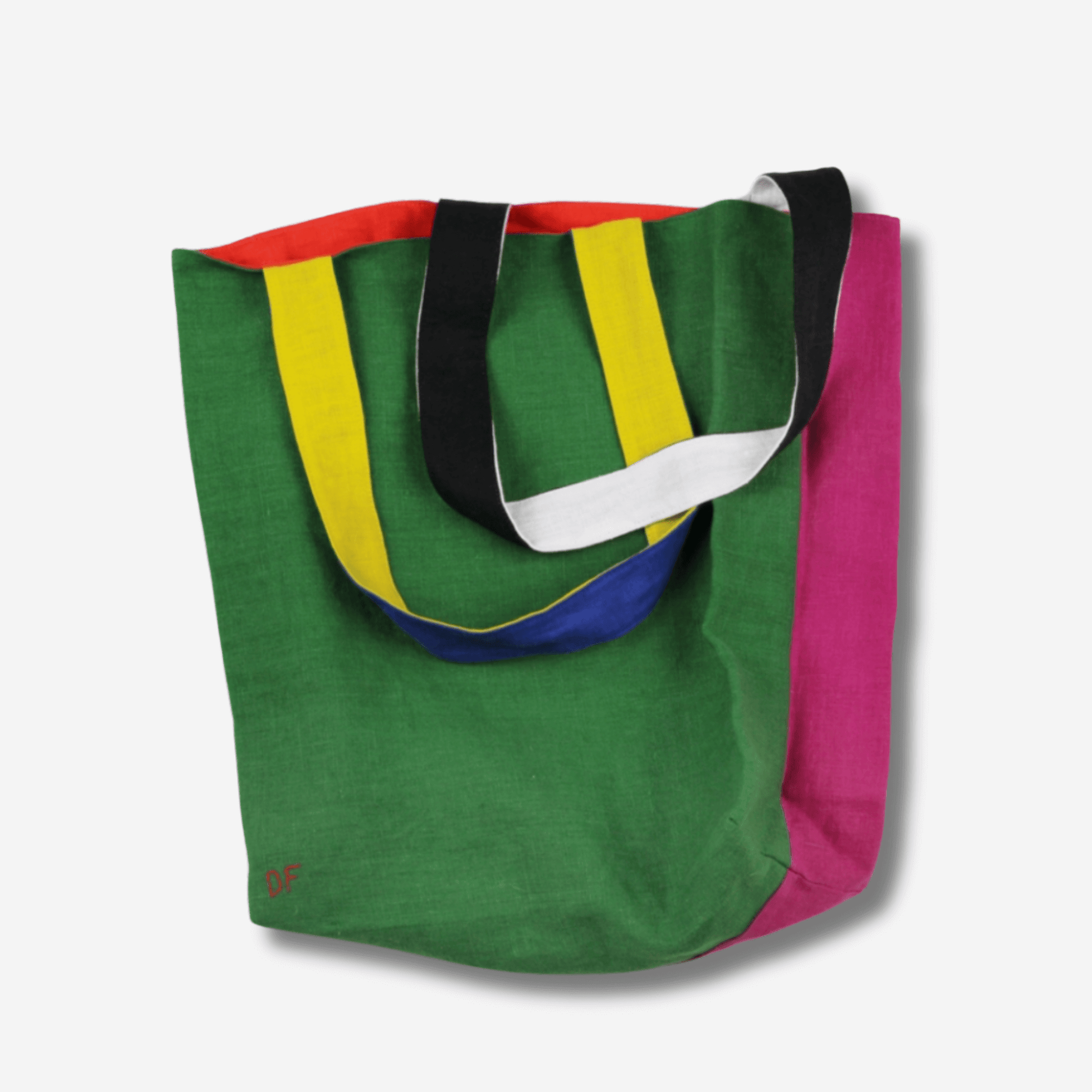 Vibrant two-sided linen tote bag in green, pink, and colorful straps, perfect for versatile daily use.
