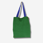 Colorful linen tote bag in green with blue straps, reversible design, perfect for groceries or daily essentials.