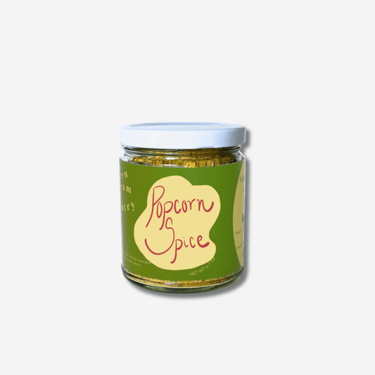 Green Dream Pantry's Popcorn Spice jar, a nutty and herby seasoning blend for flavorful snacks and dishes.