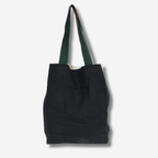Two-tone linen tote bag with green straps, reversible and versatile for daily use.