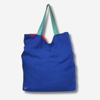 LARGE LINEN TOTE BAG in vibrant blue with colorful straps, perfect for beach days and carrying essentials.