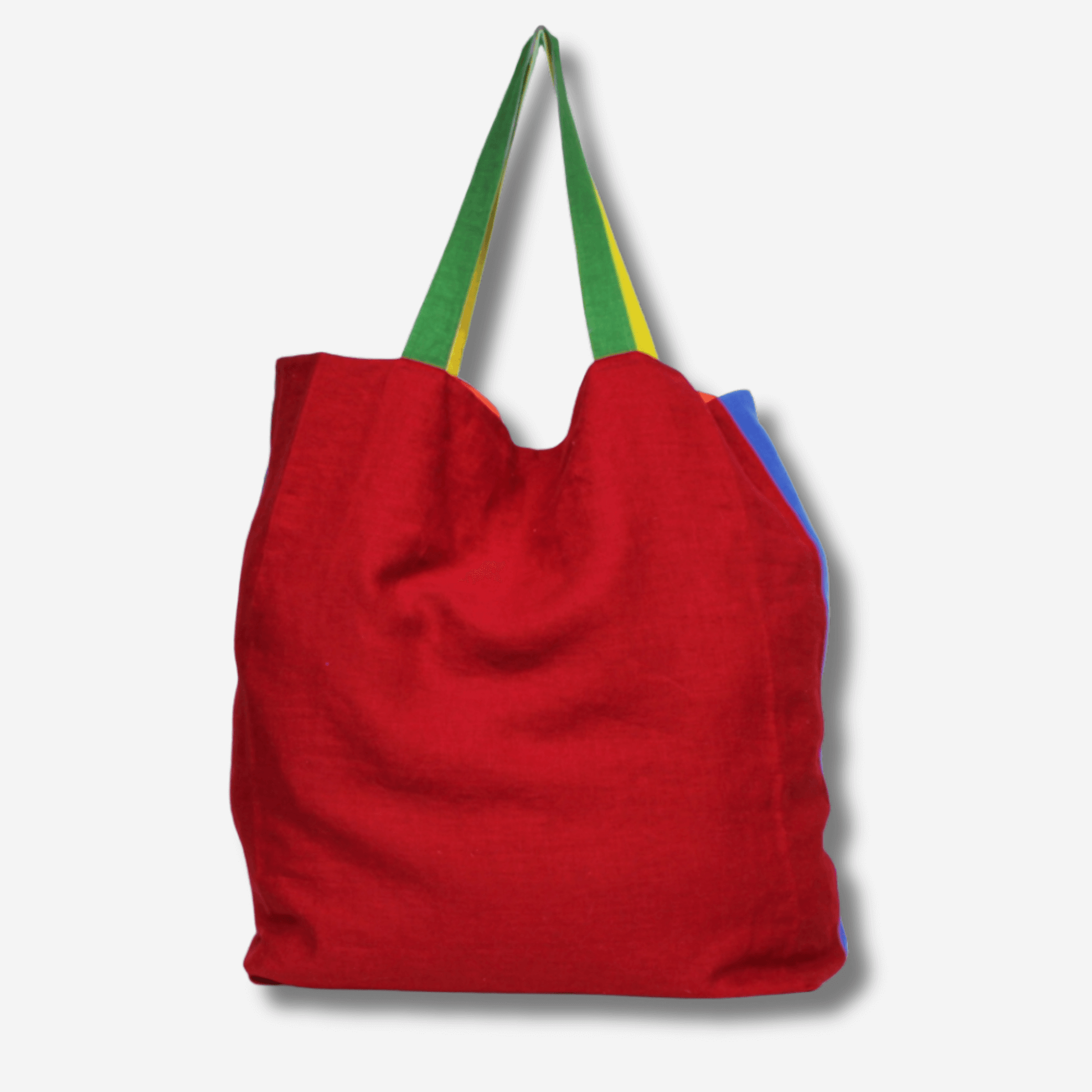 Oversized red linen tote bag with colorful straps, perfect for beach days and carrying essentials.