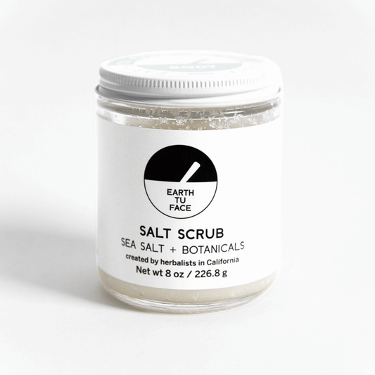 8 oz Salt Scrub jar with a clean design, combining sea salt and botanicals for exfoliation and hydration.