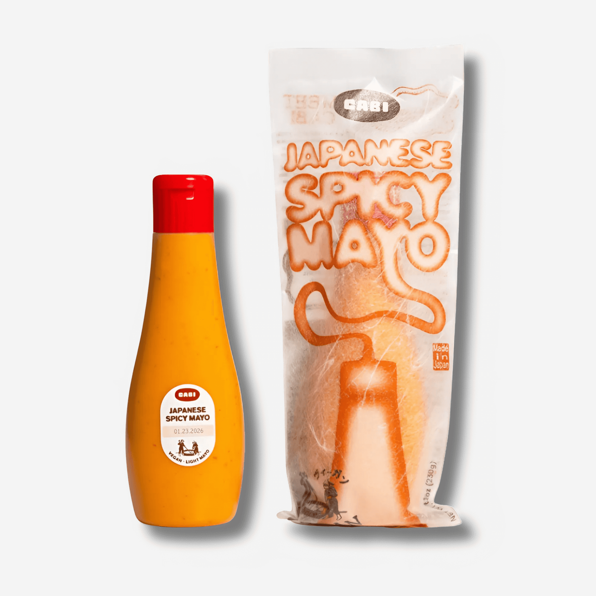 Bottle and pouch of Japanese Spicy Mayo by Cabi, creamy, plant-based sauce with bold umami flavor.