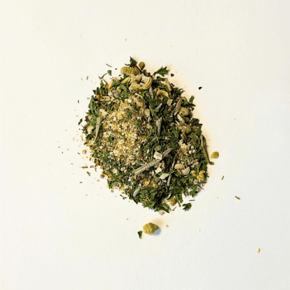 Herby Spice blend showcasing a vibrant mix of herbs, seeds, and citrus on a clean white background.